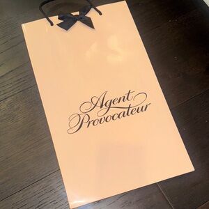 Agent Provocateur slight indentation Blush Pink Bag with Black Bow